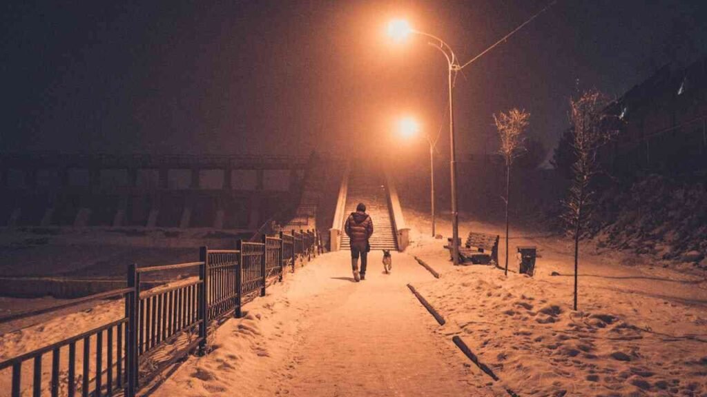 Photo of a man walking a alone street